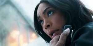 athenat-a-burning-building-in-9-1-1-season-8-episode-17-looking-at-a-suspect.jpg