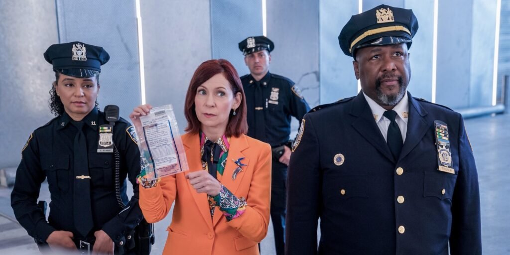 elsbeth-and-the-police-officers-hold-up-a-bag-of-evidence.jpg