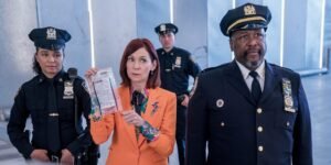 elsbeth-and-the-police-officers-hold-up-a-bag-of-evidence.jpg