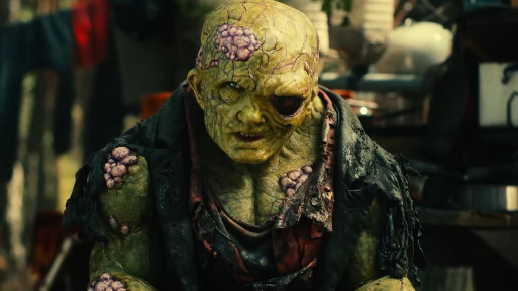 toxie-looking-suspiciously-while-sitting-in-a-junkyard-in-toxic-avenger-2025.jpg