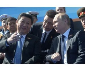 china-xi-russia-putin-sitting-bandstands-hg.jpg