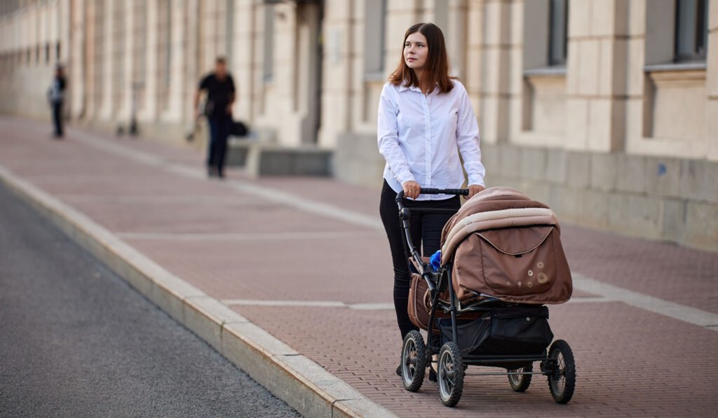 woman-baby-stroller-street.jpg